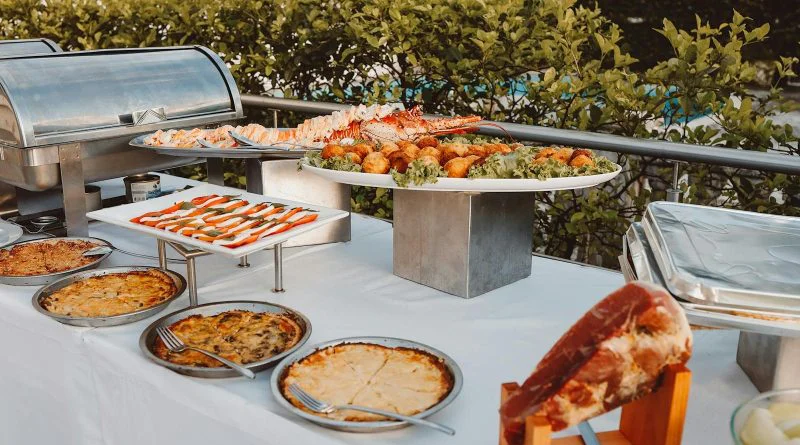 An inviting outdoor buffet offering a wide selection of fresh meals and delicacies.