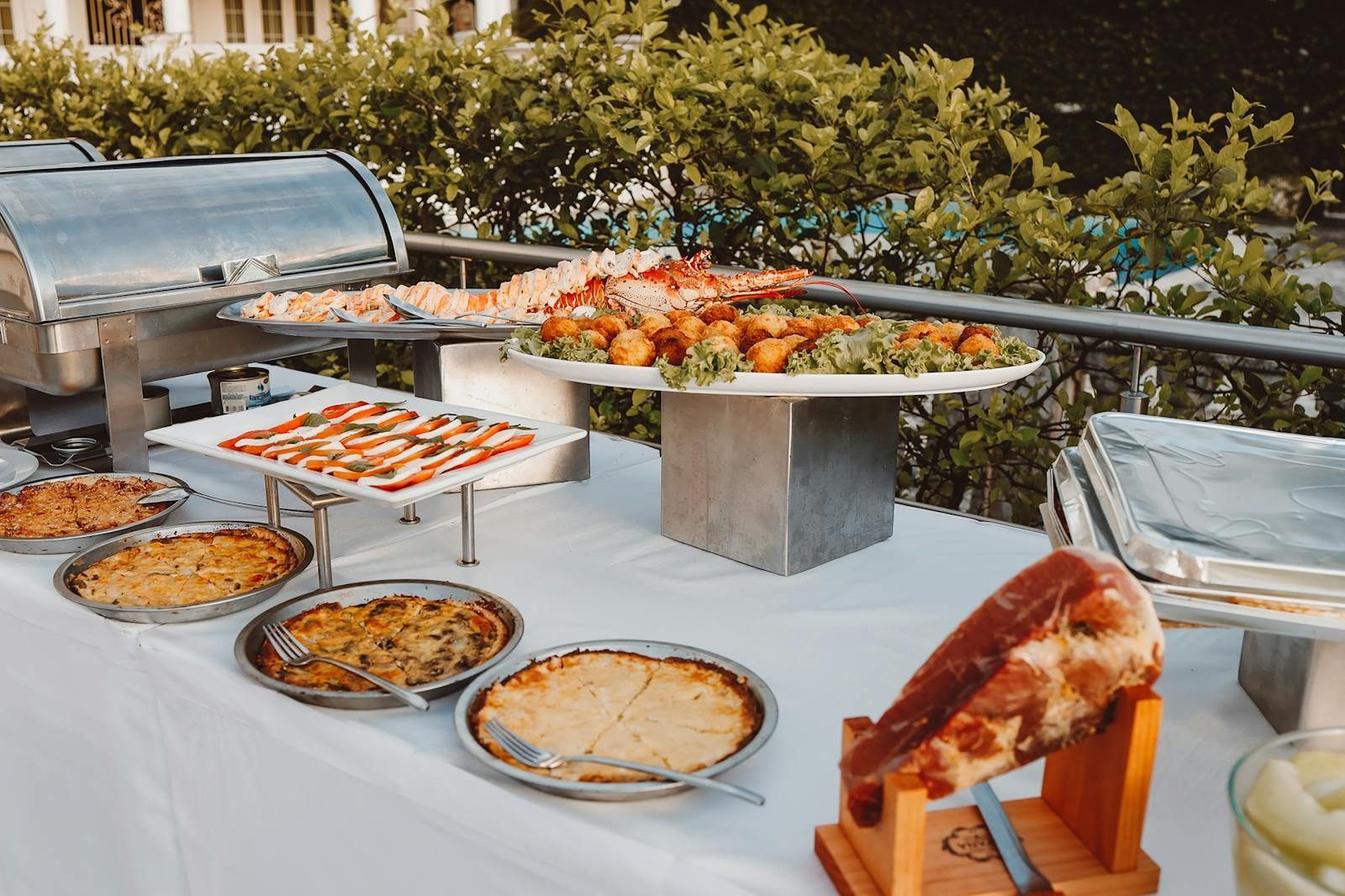 An inviting outdoor buffet offering a wide selection of fresh meals and delicacies.